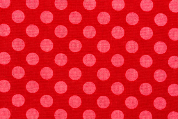 istock Close up of pink dot red background fabric. 1168382810