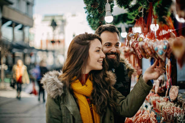 istock Young couple shopping for Christmas 1168383255
