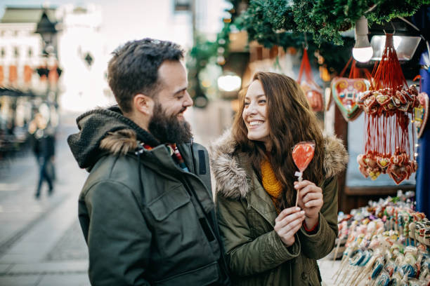 istock Young couple shopping for Christmas 1168384102
