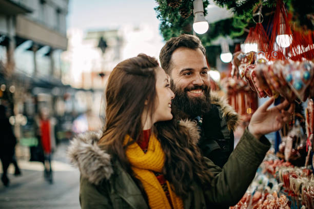 istock Young couple shopping for Christmas 1168384104
