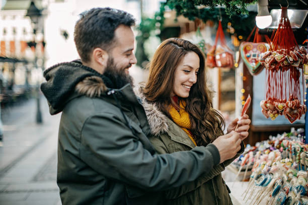 istock Young couple shopping for Christmas 1168385044