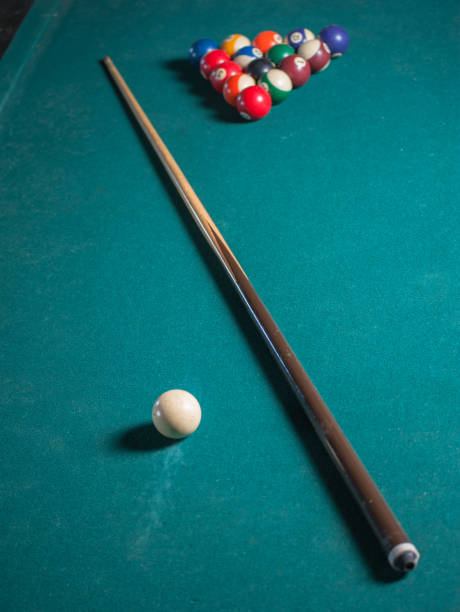 istock Billiards balls and cue on billiards table. Billiard sport concept 1168385545