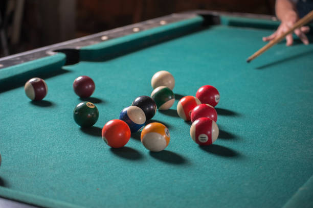 istock Billiards balls and cue on billiards table. Billiard sport concept 1168385548