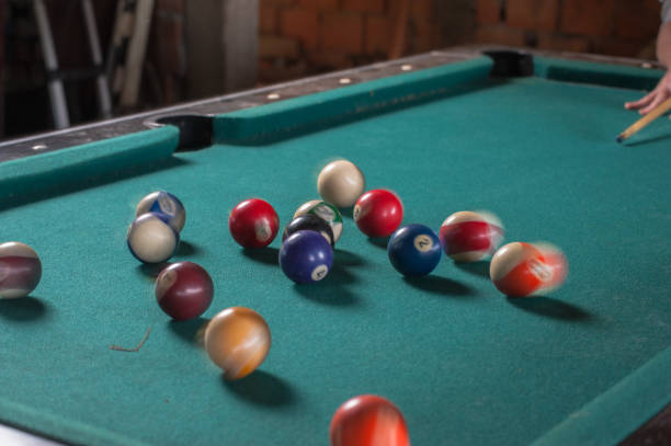 istock Billiards balls and cue on billiards table. Billiard sport concept 1168385679