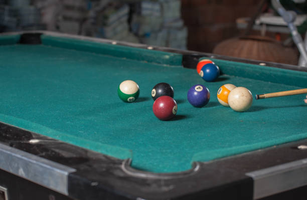 istock Billiards balls and cue on billiards table. Billiard sport concept 1168386143