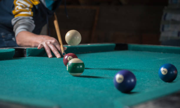 istock Billiards balls and cue on billiards table. Billiard sport concept 1168386940