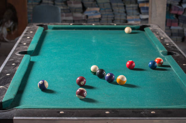 istock Billiards balls and cue on billiards table. Billiard sport concept 1168386948