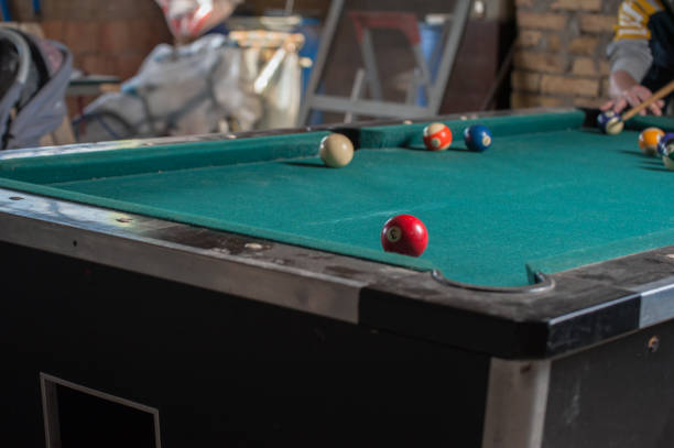 istock Billiards balls and cue on billiards table. Billiard sport concept 1168387066