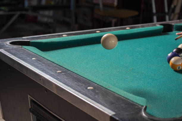 istock Billiards balls and cue on billiards table. Billiard sport concept 1168387074