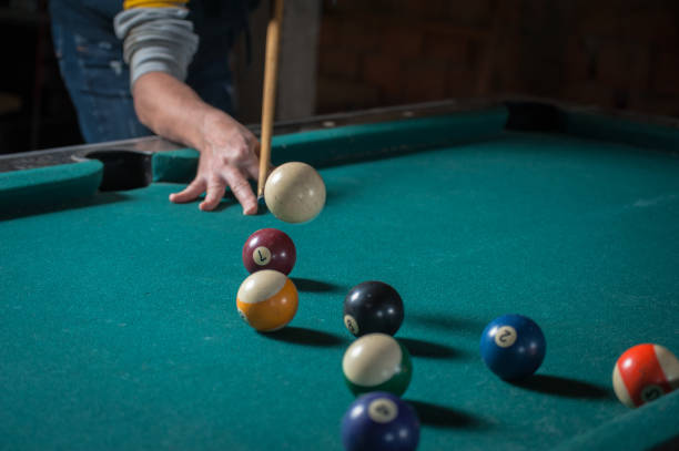 istock Billiards balls and cue on billiards table. Billiard sport concept 1168387284