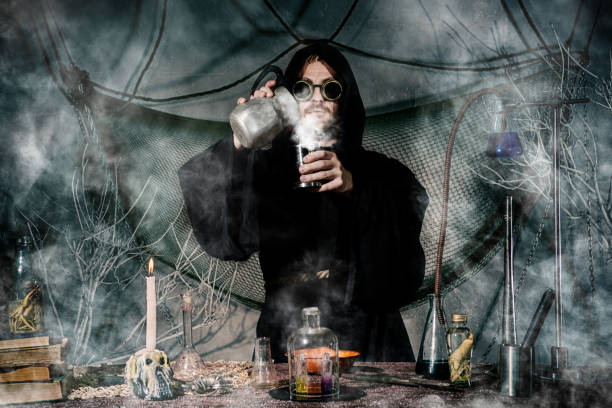 istock The medieval alchemist make magic ritual at the table in his smoke laboratory. 1168387313
