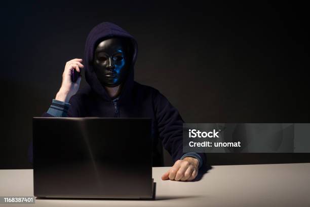Anonymous Programmer Hack Anonymous Hacker In Mask Programmer Uses A Laptop And Talking On The ...