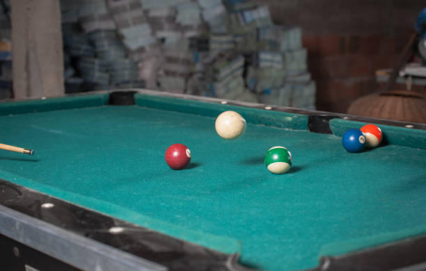 istock Billiards balls and cue on billiards table. Billiard sport concept 1168387812