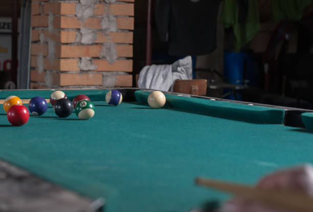 istock Billiards balls and cue on billiards table. Billiard sport concept 1168387813