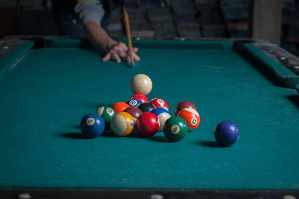 istock Billiards balls and cue on billiards table. Billiard sport concept 1168387818