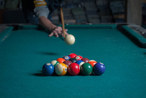 istock Billiards balls and cue on billiards table. Billiard sport concept 1168387945