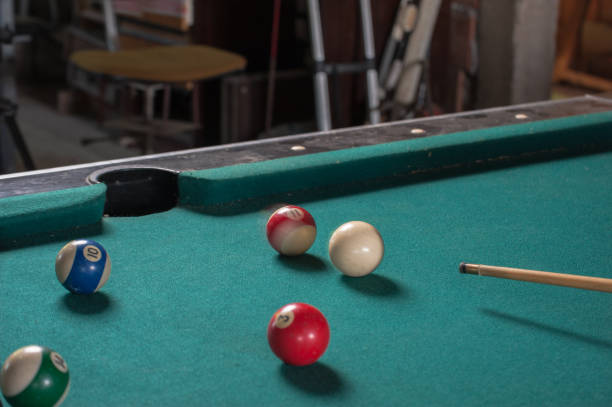 istock Billiards balls and cue on billiards table. Billiard sport concept 1168387946