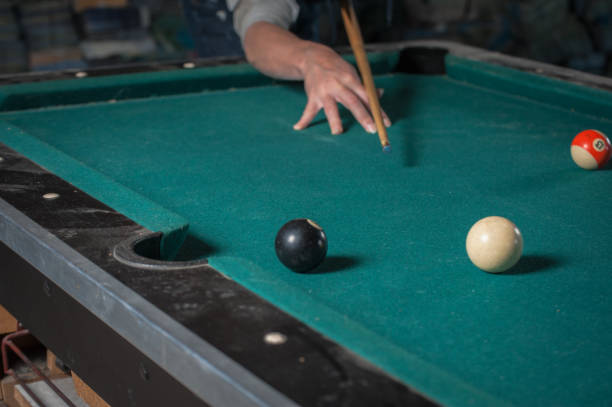 istock Billiards balls and cue on billiards table. Billiard sport concept 1168388221