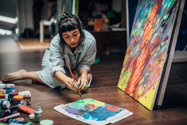istock Artist painting on the floor 1168391279