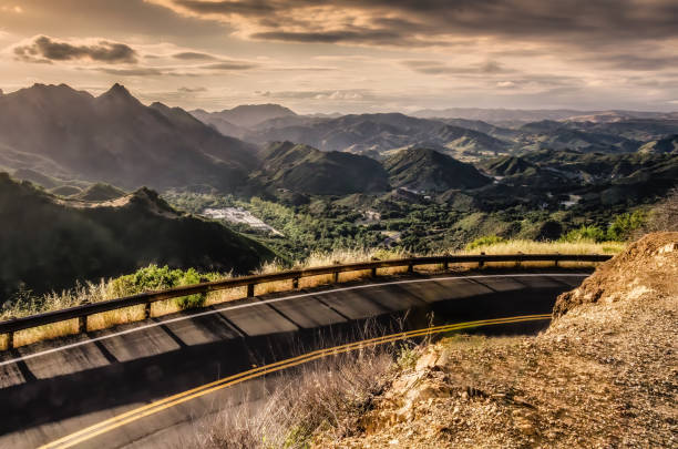 California winding highway in the Santa Monica mountains, and high angle view of Camp Gonzalez Juvenile Detention Center below.