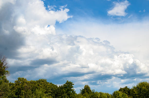 istock Fluffy clouds over the village 1168397346