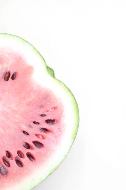 istock Fresh half of watermelon on a light beige background. 1168398883