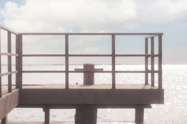istock Iron pier on the river in the afternoon 1168399637