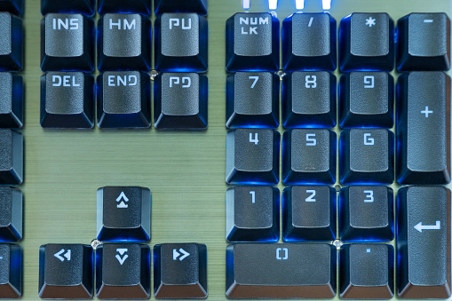 Numeric keypad black keyboard with blue backlight close-up