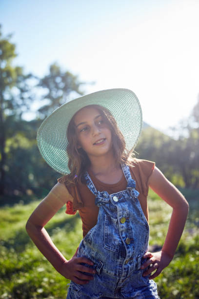 istock Cute ten year old girl posing in nature. 1168401524