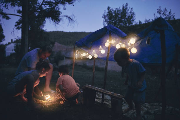 istock Father with children playing under their backyard tent. 1168401646