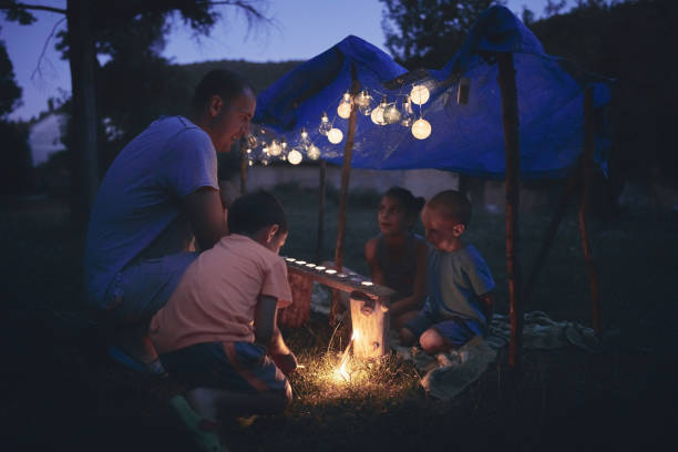 istock Father with children playing under their backyard tent. 1168401656