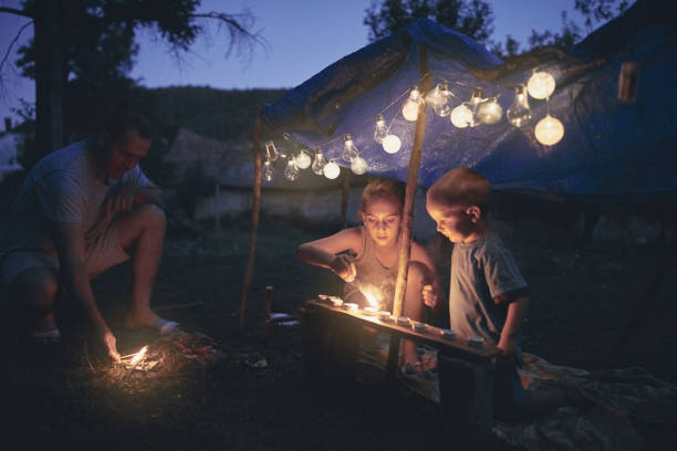 istock Father with children playing under their backyard tent. 1168401720