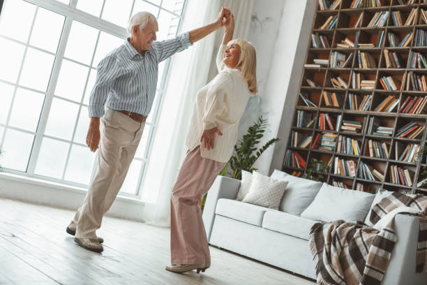 istock Senior couple together at home retirement concept dancing active dance twist 1168405877