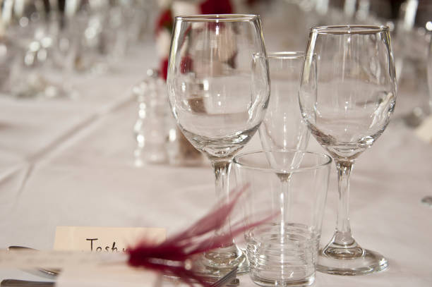 istock Formal table laid out for a wedding with white table cloth 1168405953