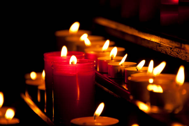 istock Collection of burning candles in netting 1168406285