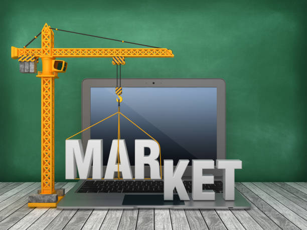 istock Tower Crane and Laptop with MARKET Word on Chalkboard Background - 3D Rendering 1168407962