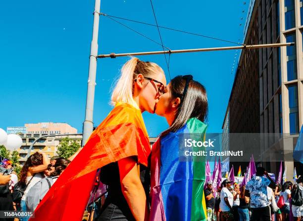 Women Kissing At Gay Pride Marching Claiming For Equality And Legal Rights For The Lgbtqi Community Stock Photo - Download Image Now