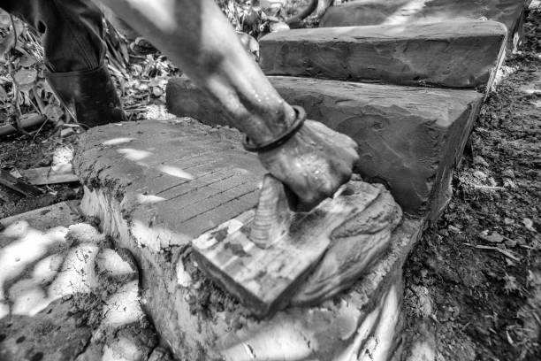 Putty knives, cement powder, gloves and red bricks isolated on white. Building materials and construction tools