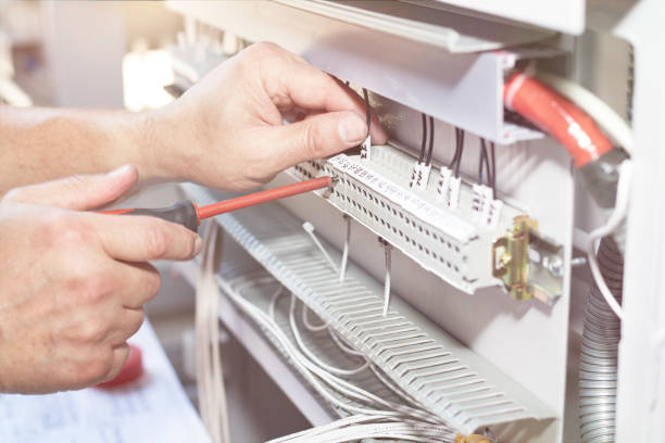 istock The electrician performs the installation and configuration of high-voltage equipment. 1168410611