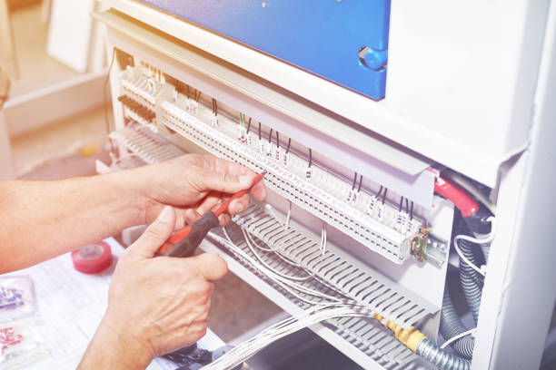 istock The electrician performs the installation and configuration of high-voltage equipment. 1168410657