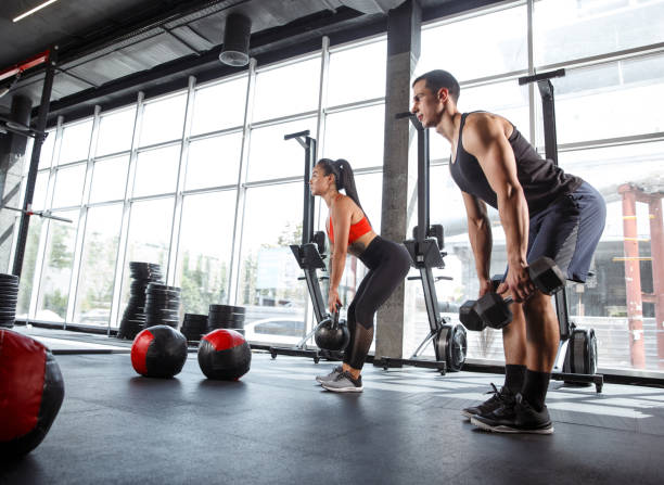 istock A muscular athletes doing workout at the gym 1168413993