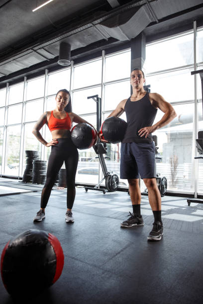 istock A muscular athletes doing workout at the gym 1168413996