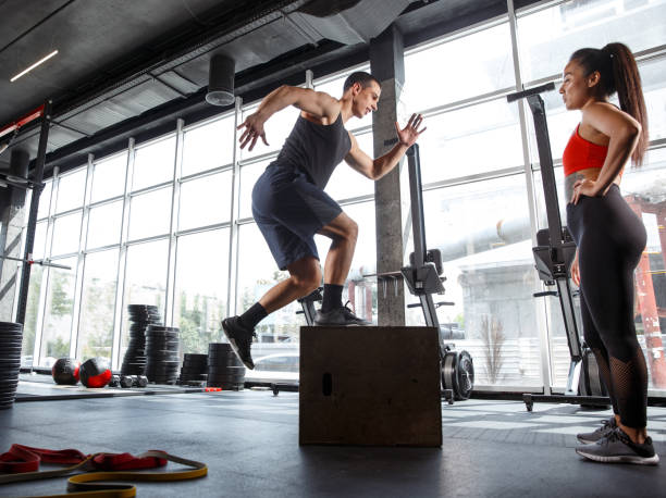 istock A muscular athletes doing workout at the gym 1168414014