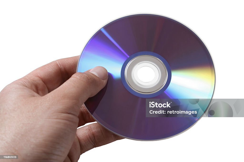 Mano che tiene un disco ottica DVD - Foto stock royalty-free di Ambientazione interna