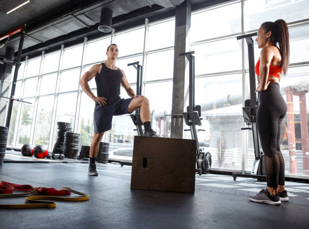 istock A muscular athletes doing workout at the gym 1168414512
