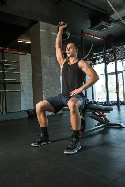 istock A muscular male athlete doing workout at the gym 1168414554