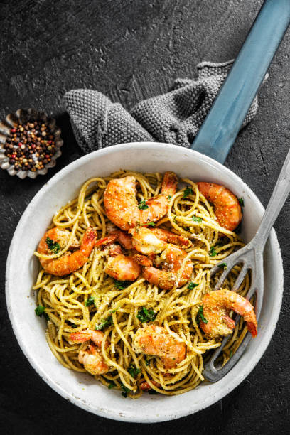 istock Spaghetti pasta with pesto and shrimps 1168414826