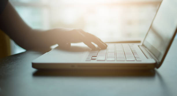 istock Woman using laptop work on desk vintage tone, soft focus 1168418768