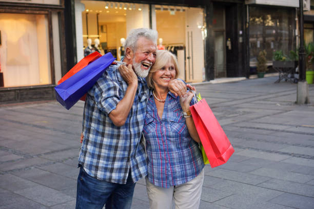 istock happy senior couple shopping 1168422412