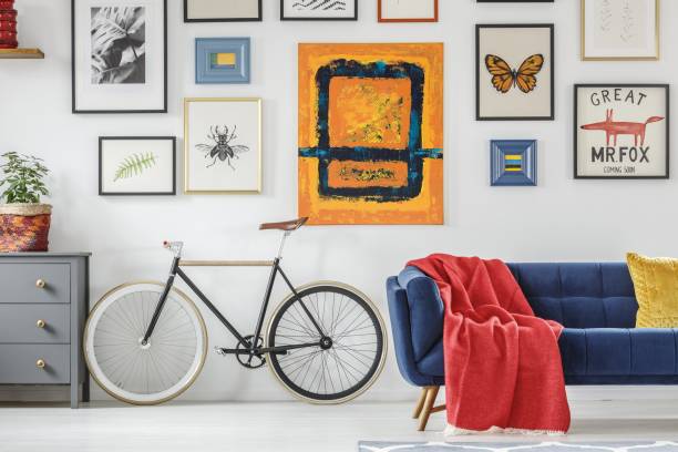 istock Bright red blanket on a navy blue settee standing next to a vint 1168423055